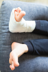 fused leg in a cast laying on the pillow