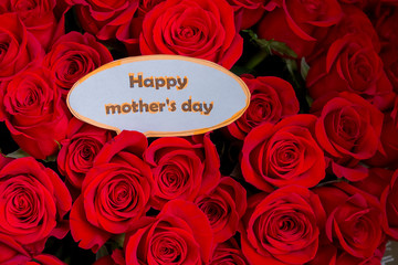Happy Mother's Day. card concept. red heart of roses with message.Happy Mother's Day.Rose background. Mothers Day greeting card. Selective focus. flowers surprise. Greeting card.Spring holidays