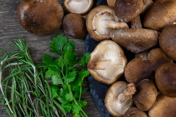 shitake mushrooms ready to be cooked with greens