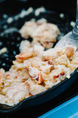 Close up of lobster meat cooking in a frying pan