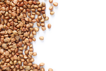 Uncooked buckwheat on white background, top view