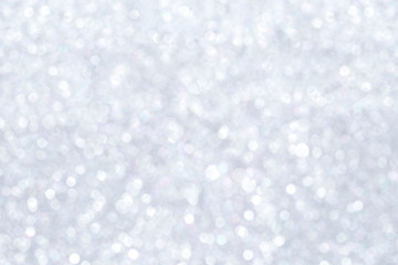 Obraz na płótnie Canvas High resolution silver colored blurred bokeh background. Abstract full frame shiny glitter background for Christmas, New Year, holiday season and celebration.