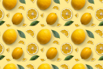 Seamless pattern of lemons and leaves. Flat lay. Food concept. Lemon on white background.