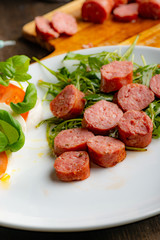 Salsiccia sausage in pan.​