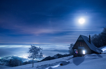 Frozen mountain refuge in Romania on a very cold winter night