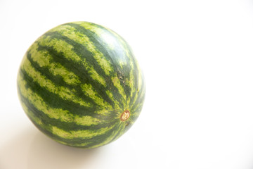 Ripe single full watermelon berry isolated on white background.