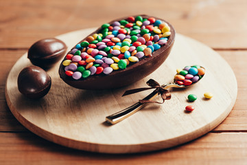 Chocolate Easter Egg on wooden background. Easter concept