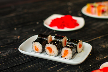 rolls and sushi set, mix different tastes. food background. top