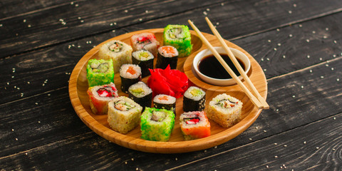 rolls and sushi set, mix different tastes. food background. top