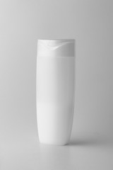 White matte plastic bottle for shampoo, shower gel, lotion, body milk, bath foam. Packaging mockup template. Front view