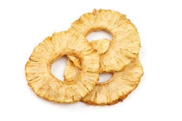 Dried candied pineapple rings, top view, isolated on white background