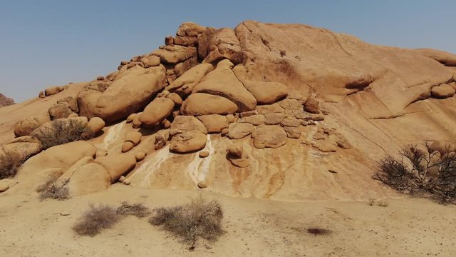 Arid desert landscape of Spitzkoppe mountain in Central Namibia, Aerial drone shot