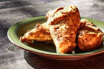 Cooking base kitchen concept. Fried roasted chicken chicken with curry sauce close up.