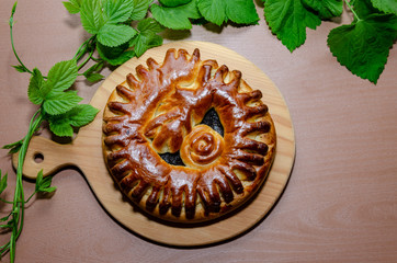 Pie with filling on the cutting board