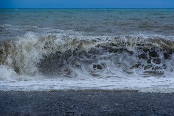 Stormy sea waves breaking near the coast