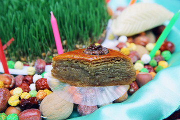 Navruz Nowruz holiday, the spring New Year holiday. Baklava is in the background Xoncha . Isolated and macro shot of Novruz holiday cookie Paxlava .
