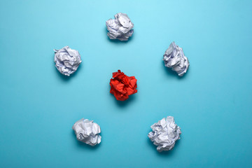 Crumpled paper balls on a blue background