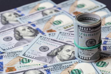 Fototapeta premium Cash of hundred dollar bills, dollar background.