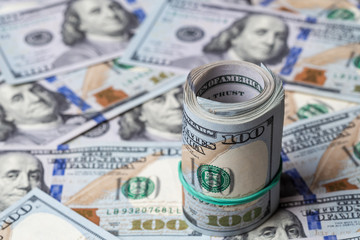 Fototapeta premium Cash of hundred dollar bills, dollar background.