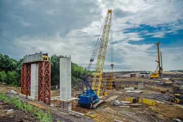 Crane lifts formwork for bridge construction