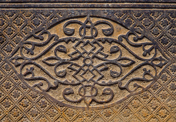 Beautiful pattern on the vintage metal floor paving pile outdoors.