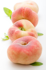 fresh peaches on white