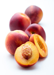 fresh peaches on white