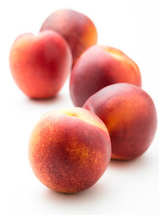 fresh peaches on white