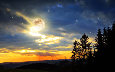 Milky Way star in night skies, full moon and trees.
