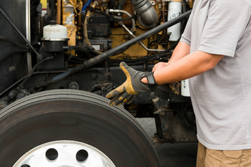 Truck driver putting on gloves