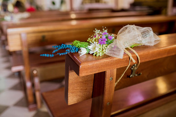 flowers in chairs wedding decoration