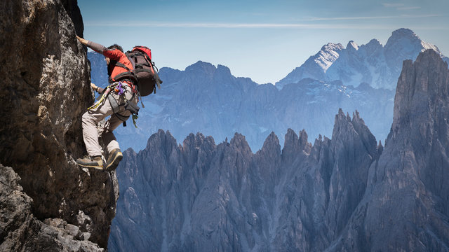 Man rock climbing in Dolomites, Italy