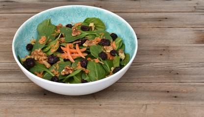 Hashtag carrot, spinach, cranberry, walnut salad