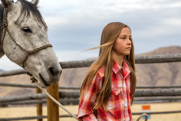 Girl leading horse