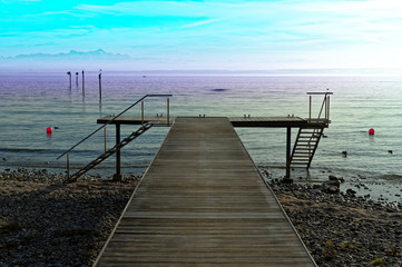 Fototapeta premium Boat dock on Lake Constance with a view of the Alps