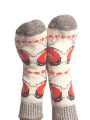 Wool socks on woman's feet isolated on white background
