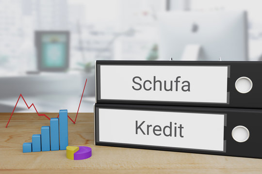 Bonit&auml;t Auskunft. Ordner beschriftet mit den W&ouml;rtern Schufa und Kredit liegen neben Diagrammen auf einem Schreibtisch. B&uuml;ro im Hintergrund.