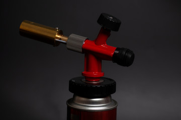 Manual gas burner isolated on black background