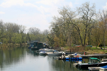 Boats and Houseboats in a Channel