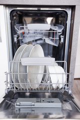 Open dishwasher with clean dishes