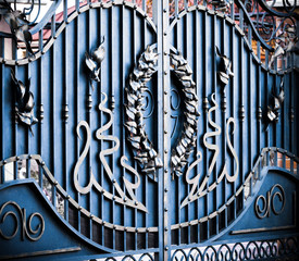 Wrought-iron gates, ornamental forging, forged elements close-up.