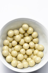 Tasty white chocolate ball in cup isolated on white background