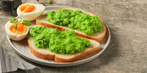 green peas, avocado and vegetable pate - sandwich (healthy breakfast). food concept. top view