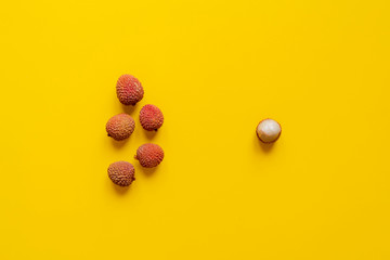 fresh lychees on yellow background isolated text mockup b