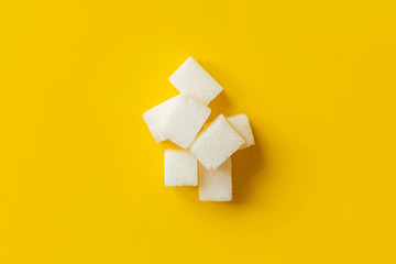 sugar cube on yellow background isolated design mockup b