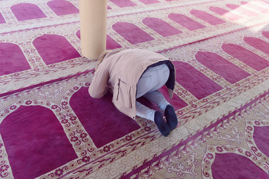 Religious muslim prayer praying inside the big mosque.