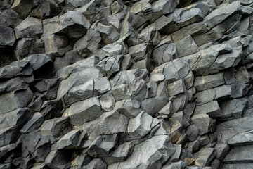Basalt volcanic rock formations in Reinisfjara beach near Vik in northern Iceland