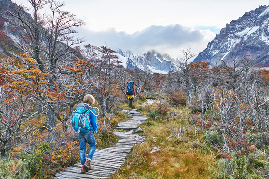 Argentina, Patagonia, El Chalten, mother and son hiking at Cerro Torre in Los Glaciares National park