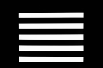 Black and white striped background on black backdrop