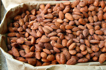 almonds in sugar syrup. almonds in a bowl